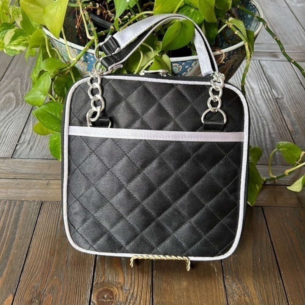 Nice black quilted satiny travel cosmetics bag with handles